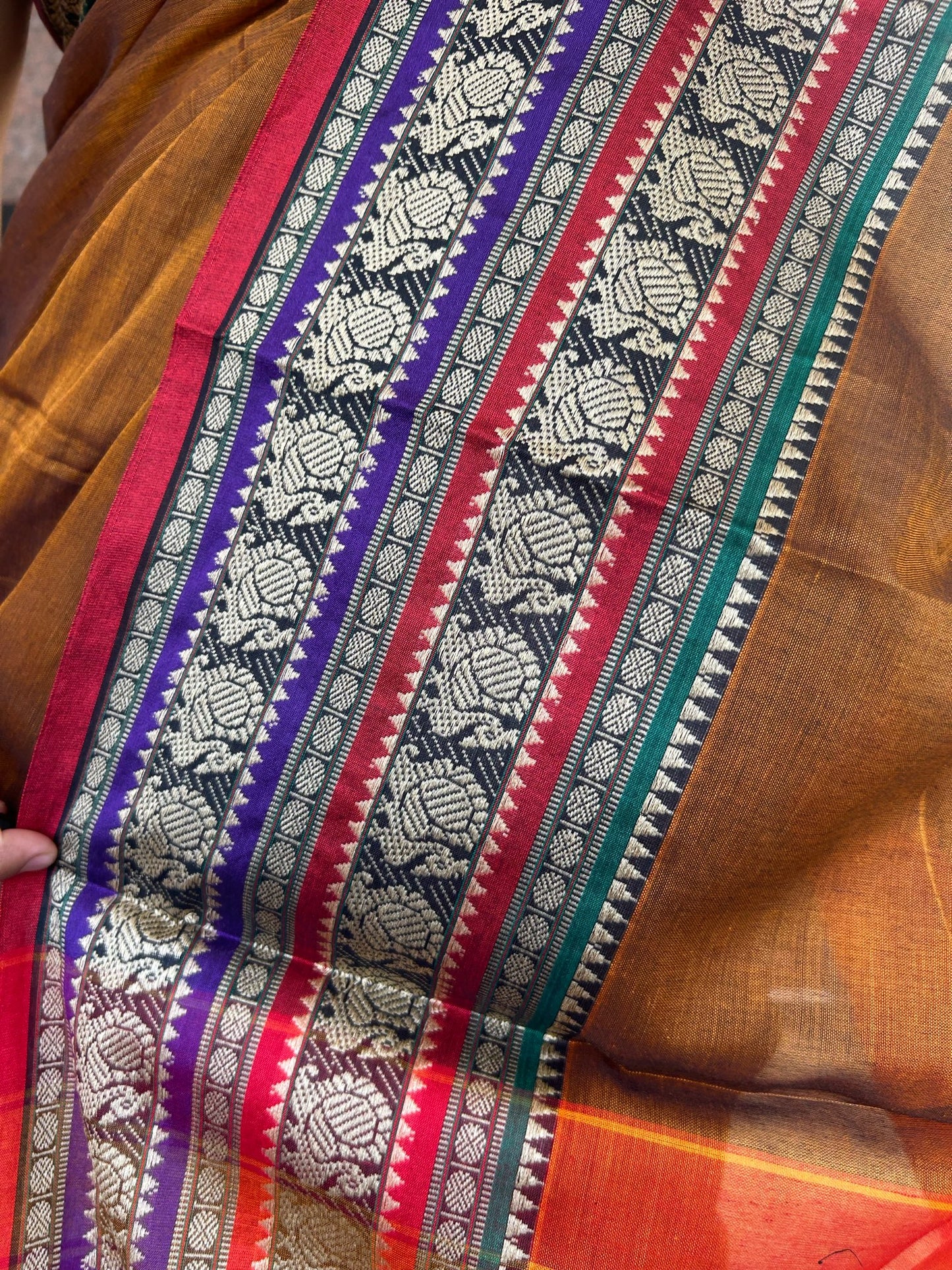 Rust orange Narayanpet saree.