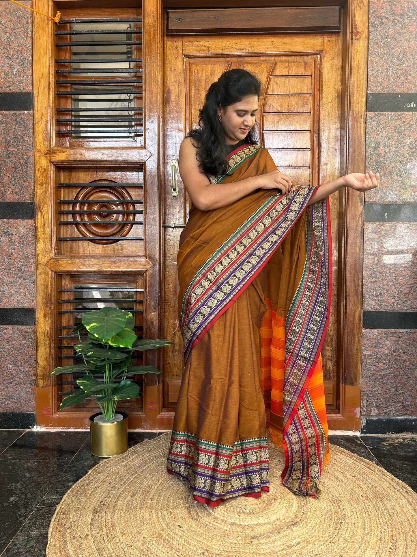 Rust orange Narayanpet saree.
