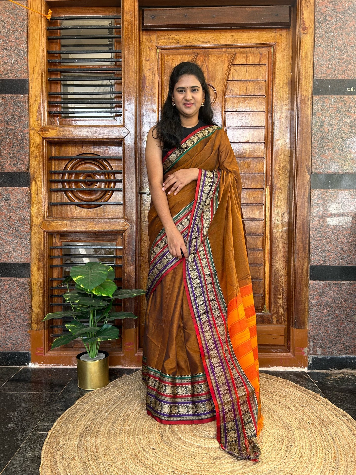 Rust orange Narayanpet saree.