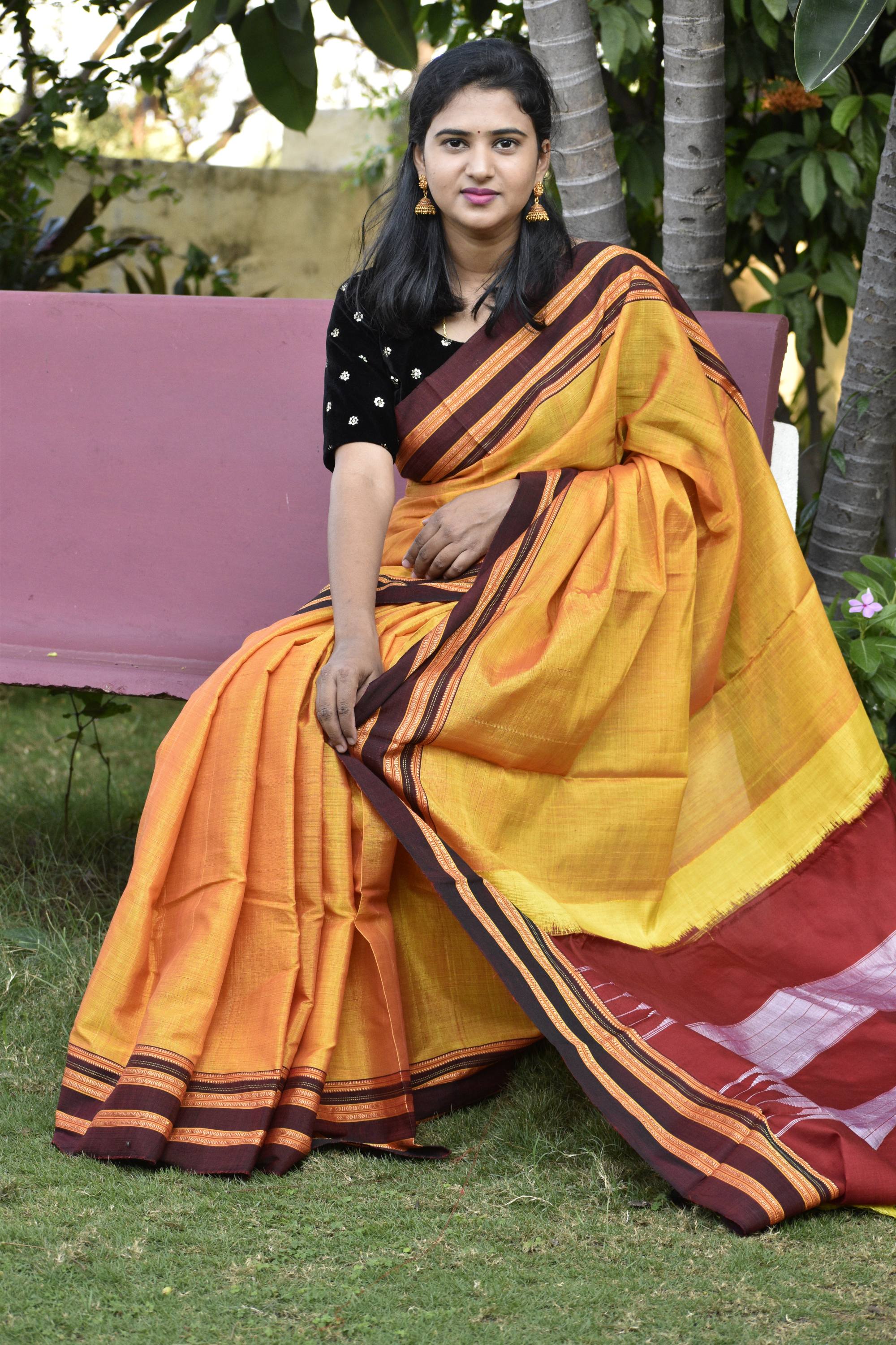 Multi-hued checked Chettinad cotton saree with buttas on body &  pallu,border of Ram Setha figurines & pallu of stripes